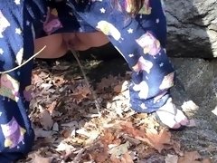 Wife pissing outside in the leaves
