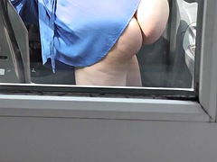 Sexy MILF in a robe without panties cleaning the inside of a car in the yard. No panties. Naked in public. Outdoor. Outside