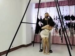 Sexy slender Oriental babe introduced to extreme bondage