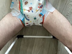 A skinny guy put on an XL diaper