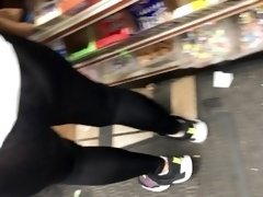Black transparent tight bending over in store